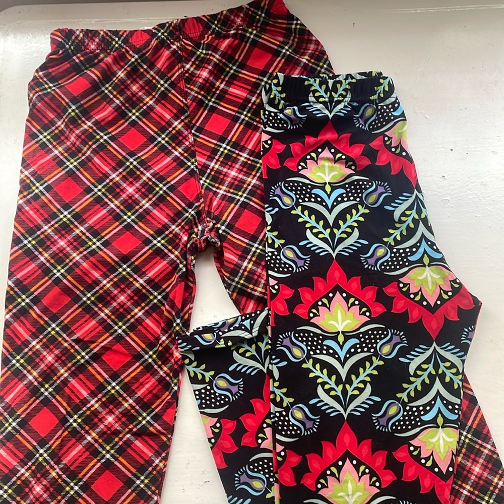 Two pairs Agnes & Dora S/M adult leggings fit US sizes 4-12. Near new condition